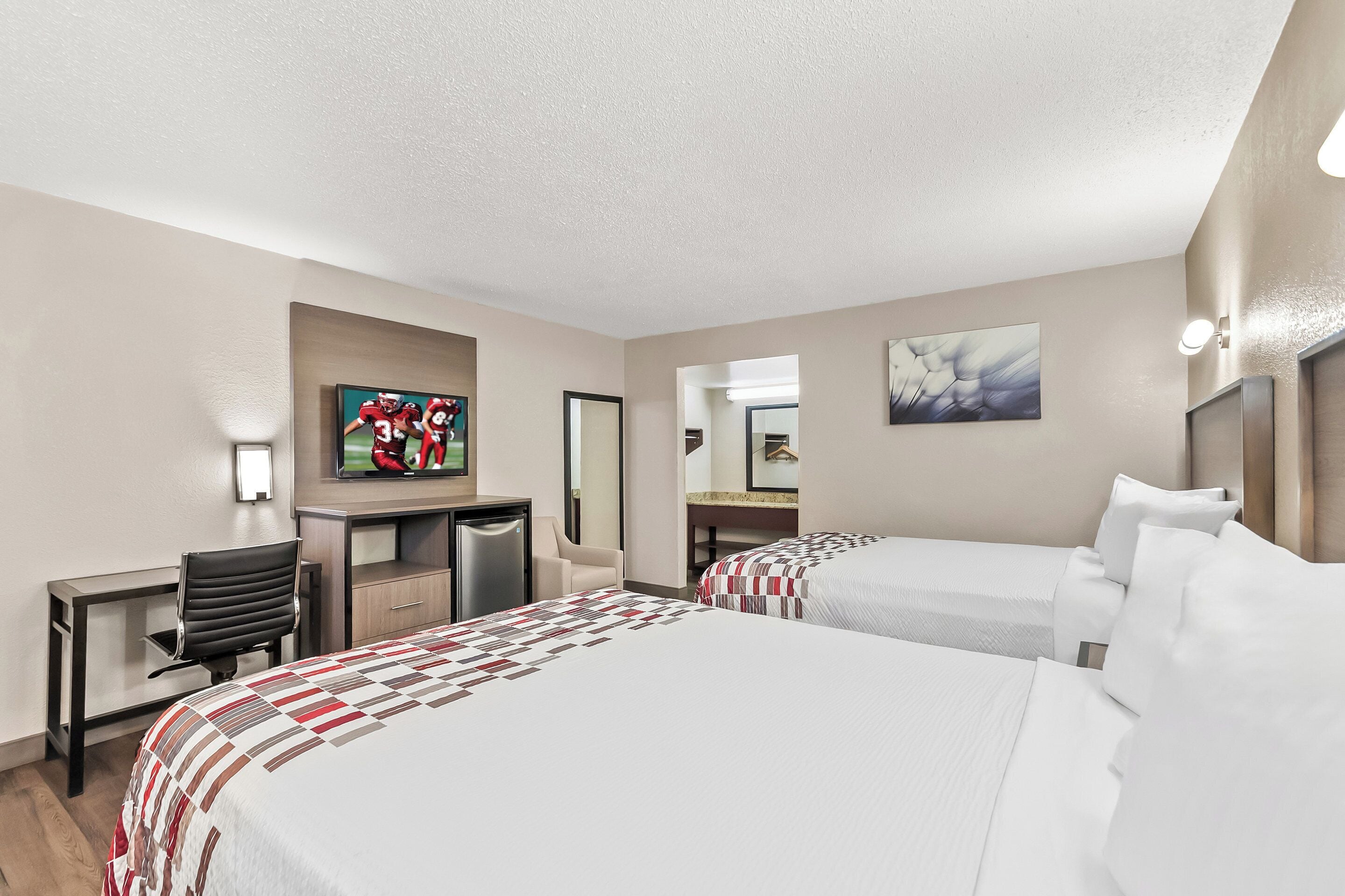 Desk, laptop workspace, blackout drapes, free cribs/infant beds