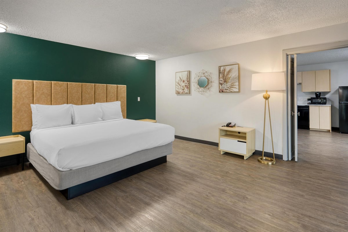 Suite, 1 King Bed, Balcony, Pool View | Iron/ironing board, bed sheets