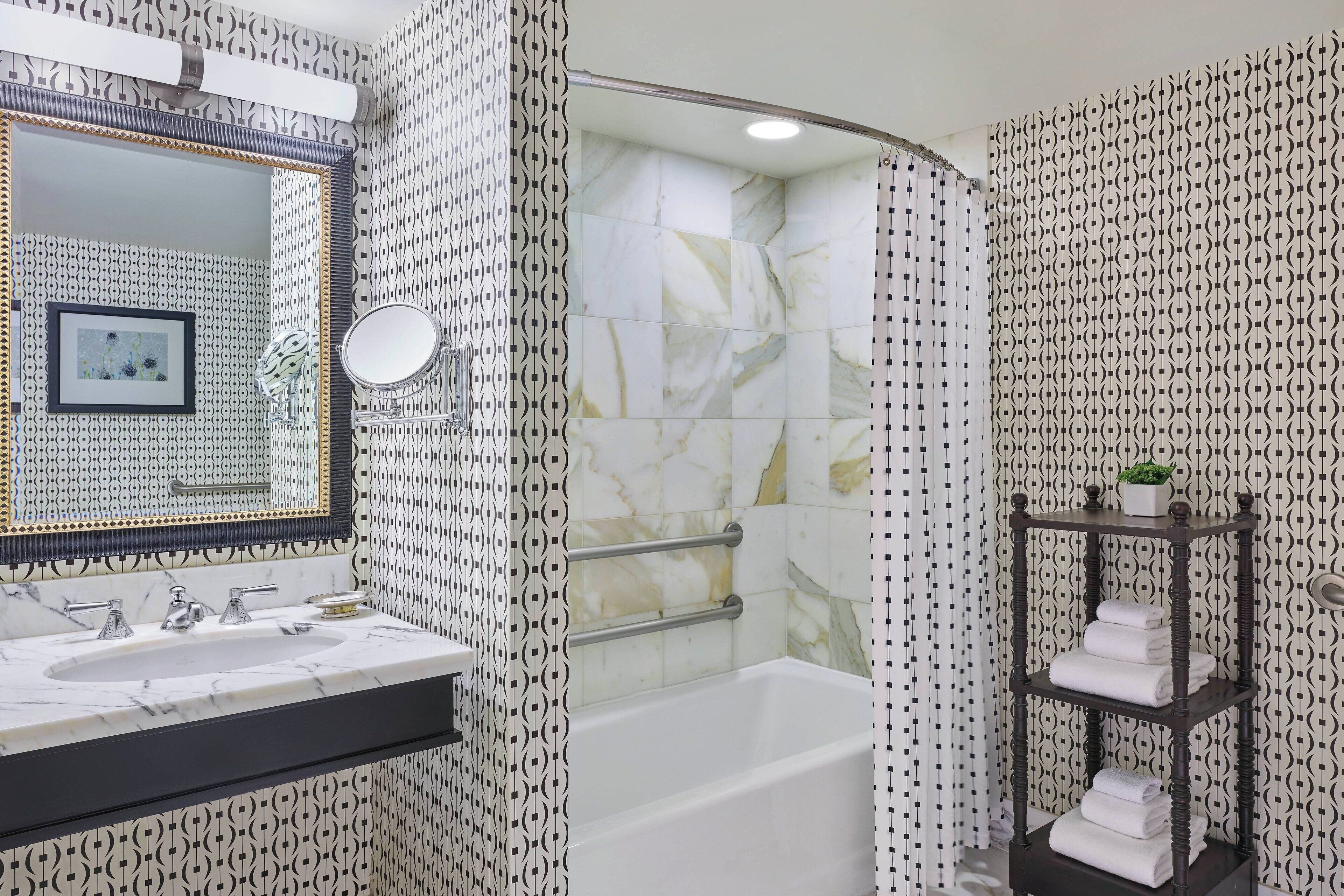 designer toiletries, hair dryer, bathrobes, towels