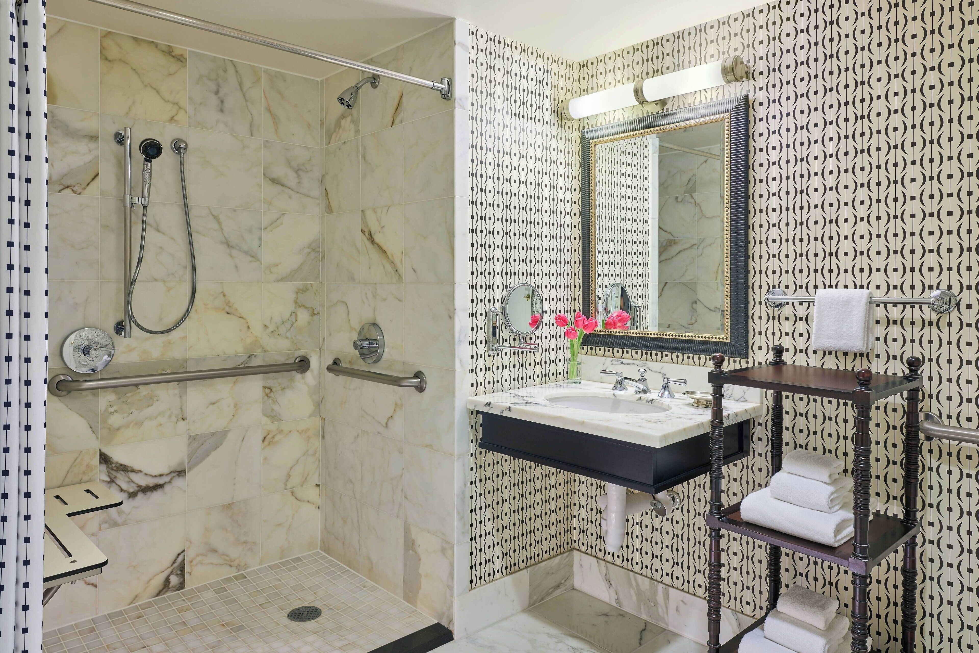 deluxe room, 1 king bed (mobility accessible, roll-in shower) | bathroom | designer toiletries, hair dryer, bathrobes, towels