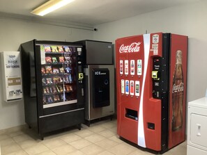 Two vending machines, one with a Coca-Cola logo and another with a soap and bleach sign. - Red Roof Inn Amarillo West (Amarillo)