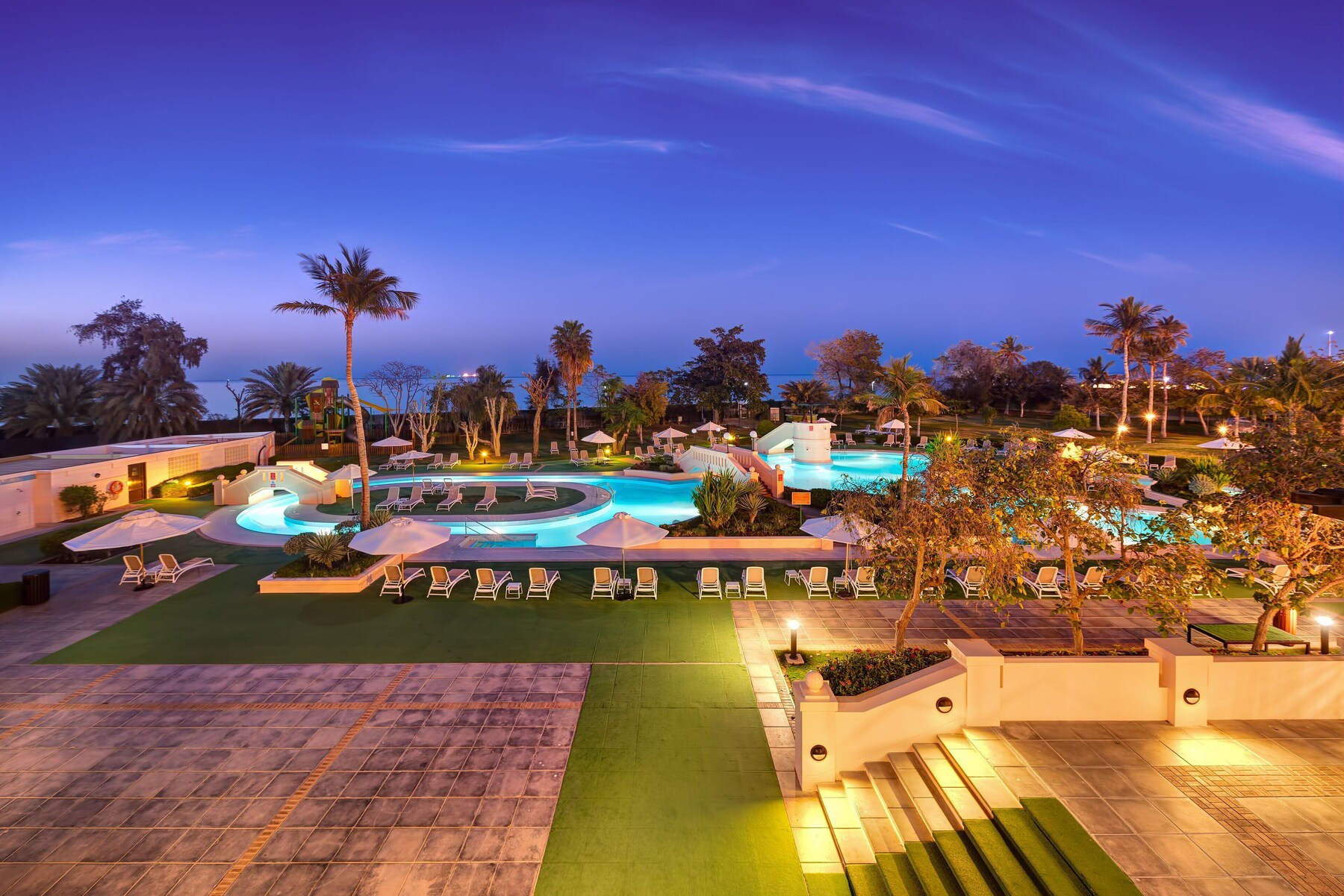 3 outdoor pools, open 8:00 AM to 9:00 PM, pool umbrellas, pool loungers