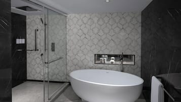 A modern bathroom with a freestanding bathtub, a glass shower enclosure, and a vanity with a mirror.