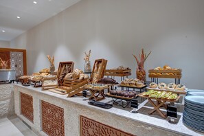 A buffet with various baked goods and pastries. - InterContinental Muscat by IHG (Muscat)