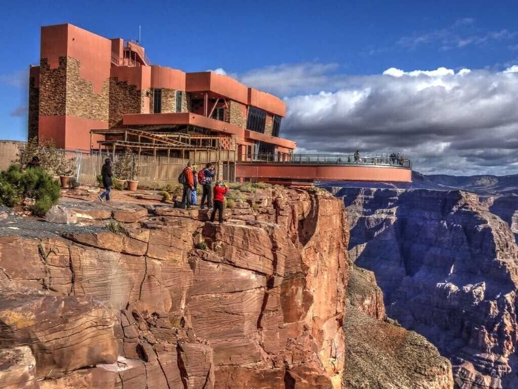 A hotel with a unique cliffside architecture overlooking a canyon.