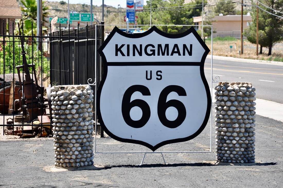 A road sign for Kingman, US Route 66.