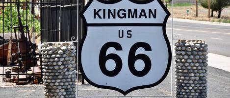A road sign for Kingman, US Route 66.