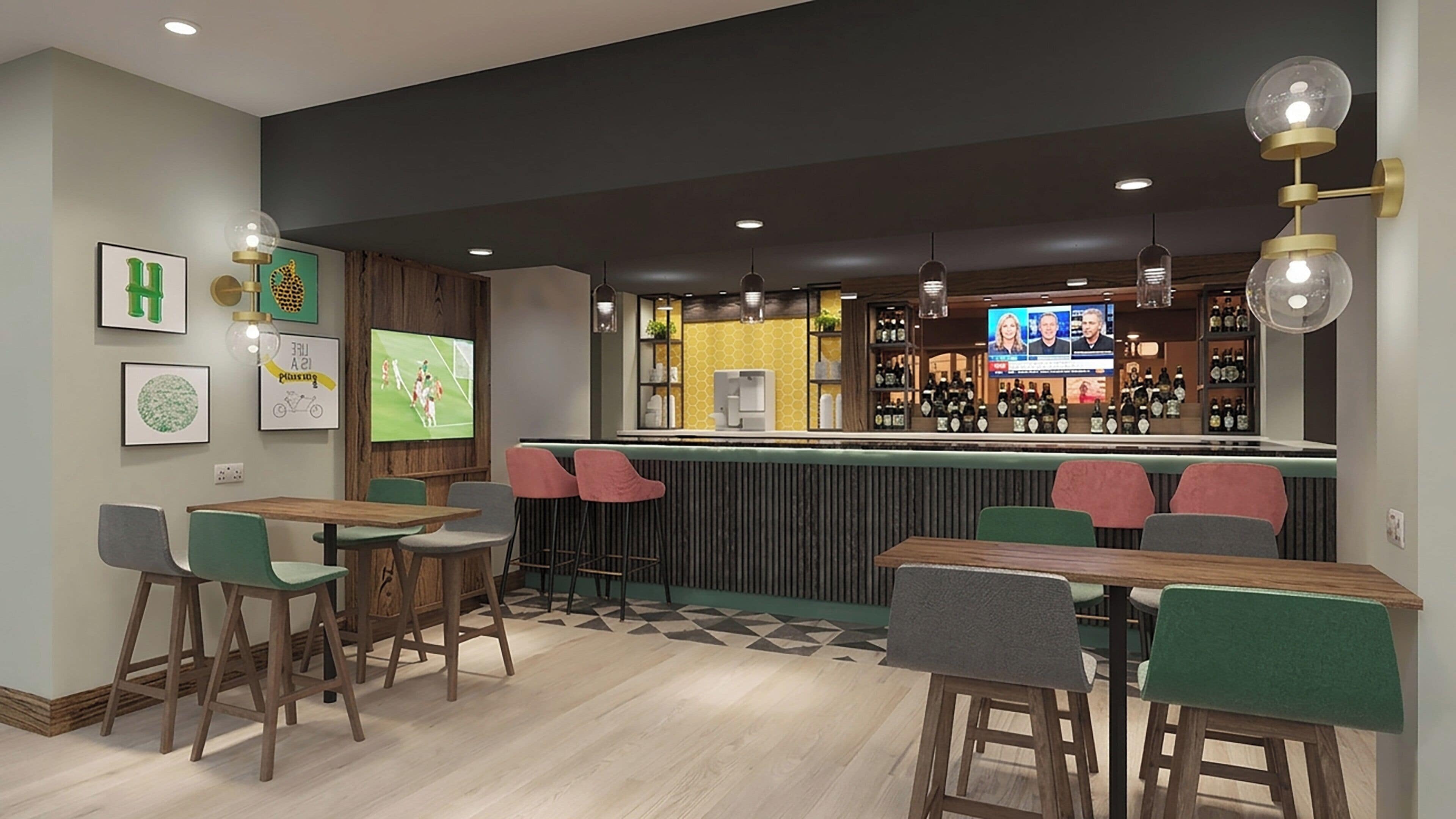 A bar area with wooden tables and chairs, a television screen, and a bar counter with bottles.