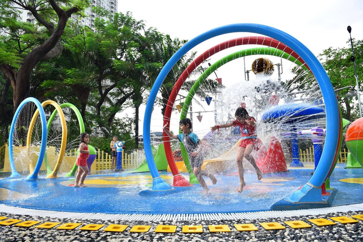 A water play area with multiple arches and water jets.