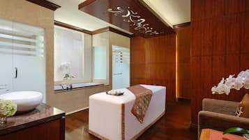 Enjoy a serene bathroom retreat with a large sink, mirror, and plush seating area.