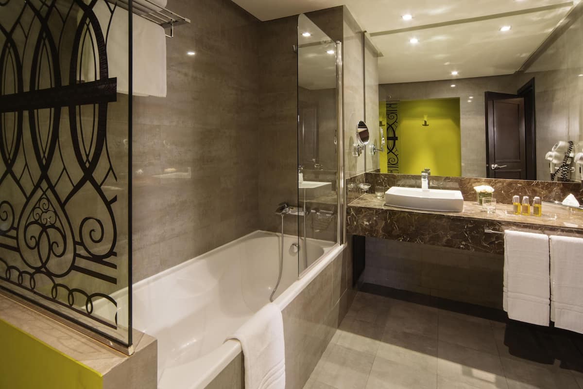 Deluxe Suite, 1 King Bed | Premium bedding, down comforters, minibar, in-room safe