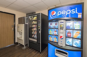 A vending machine area with a Pepsi machine and a refrigerator. - Red Roof Inn & Suites Hermitage (Hermitage)