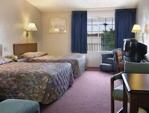 Desk, laptop workspace, iron/ironing board, bed sheets