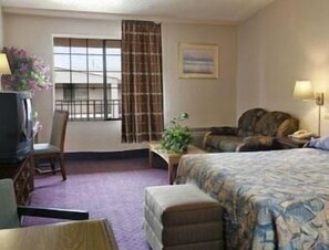 Desk, laptop workspace, iron/ironing board, bed sheets