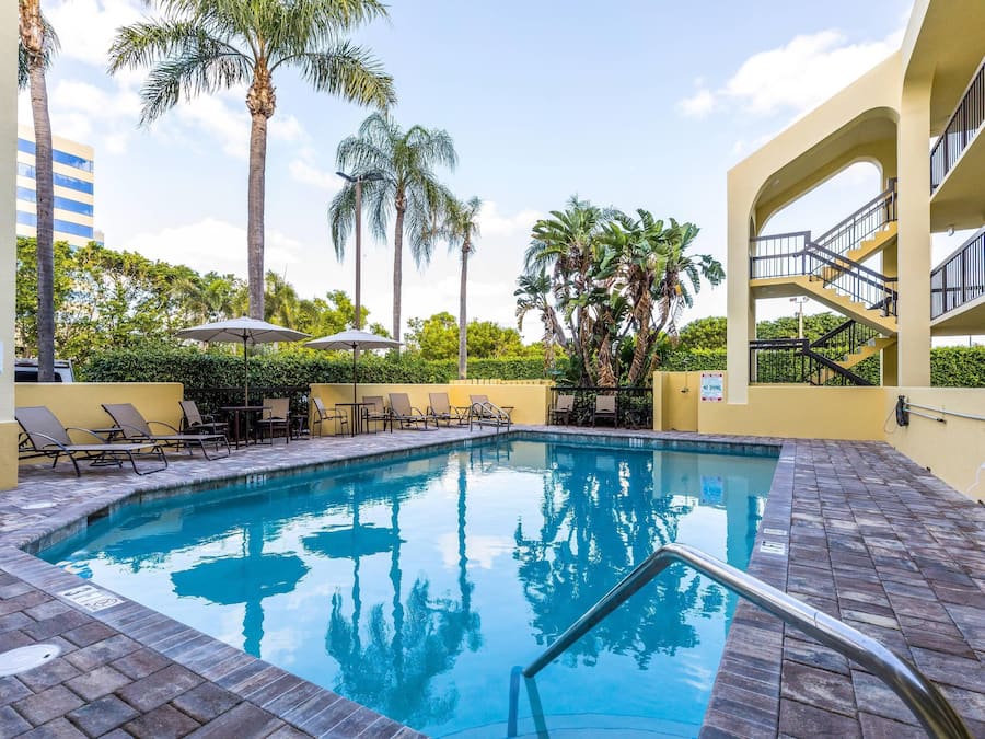 Outdoor pool, open 9:00 AM to 9:00 PM, pool umbrellas, pool loungers