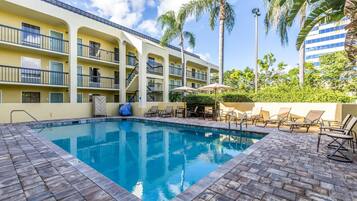 Outdoor pool, open 9:00 AM to 9:00 PM, pool umbrellas, pool loungers