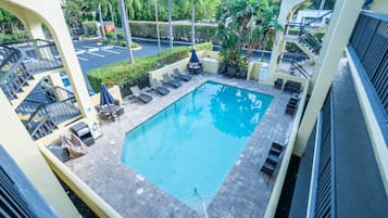 Outdoor pool, open 9:00 AM to 9:00 PM, pool umbrellas, pool loungers