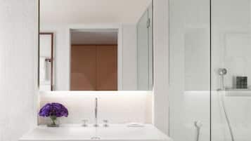 Room, 1 King Bed, Non Smoking | Bathroom | Rainfall showerhead, designer toiletries, hair dryer, bathrobes