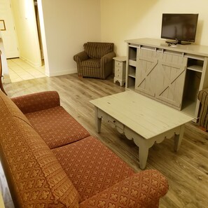 Room, Multiple Beds, Non Smoking (Efficiency) | Living room | 50-inch flat-screen TV with cable channels, TV, pay films