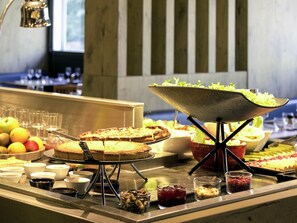 A buffet with various food items and a salad bar. - ibis Paris Porte d'Italie (Gentilly)