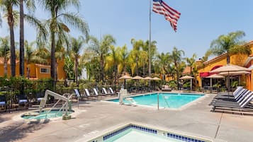 Outdoor pool, a heated pool, open 9:00 AM to 8:00 PM, pool umbrellas