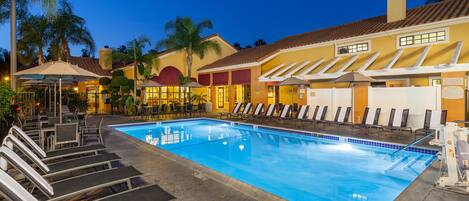 Outdoor pool, a heated pool, open 9:00 AM to 8:00 PM, pool umbrellas