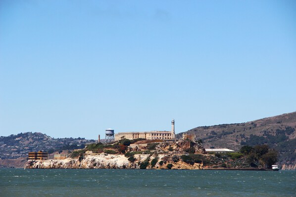 A coastal building with a lighthouse, situated on a rocky outcrop with a view of the sea. - Hilton San Francisco Financial District (San Francisco)