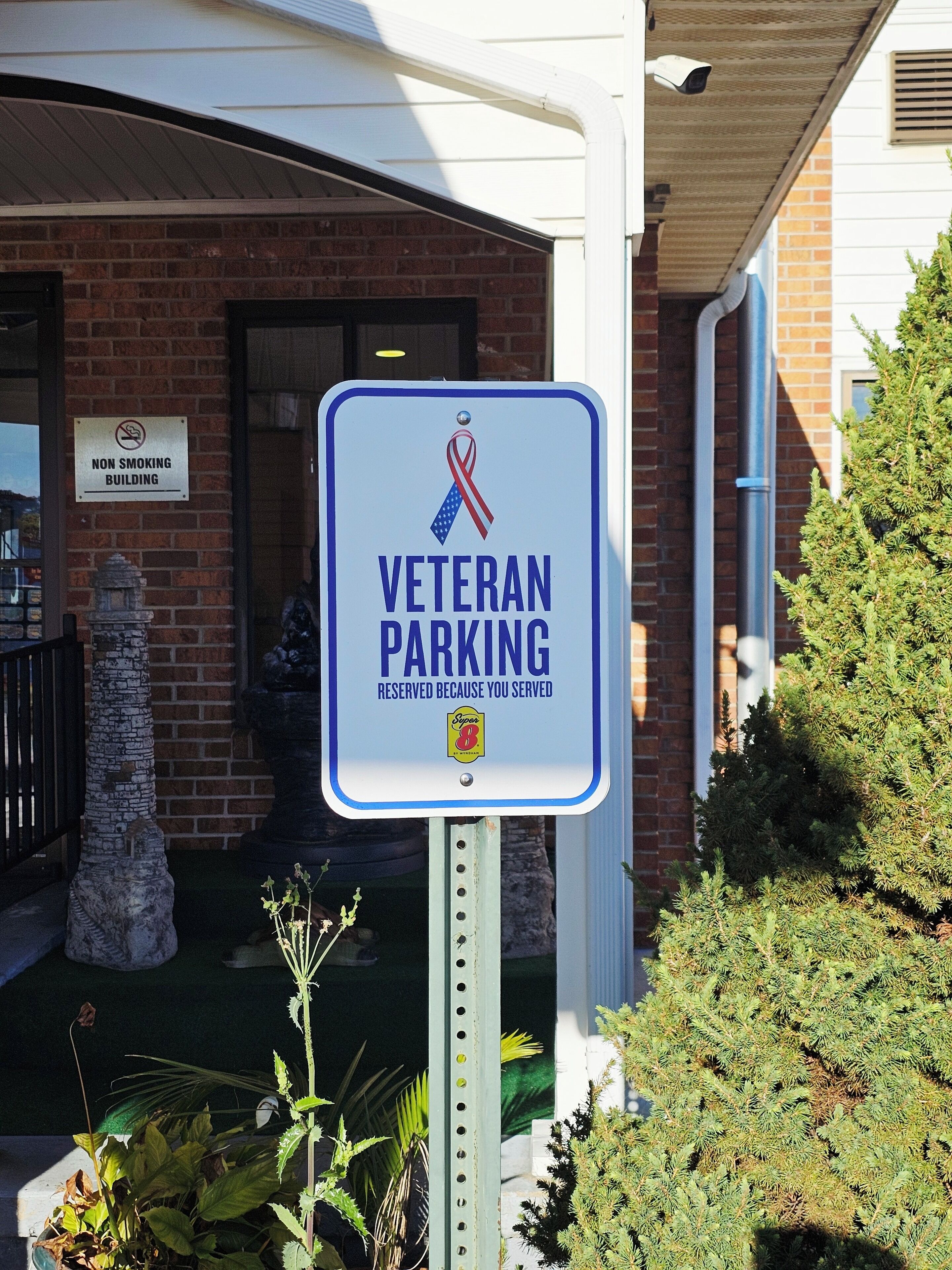 A sign indicating veteran parking reserved because you served.