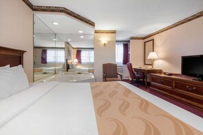 Premium bedding, desk, laptop workspace, blackout drapes