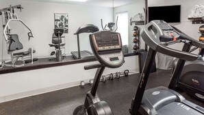 A gym with cardio equipment, dumbbells, and a large mirror. - Days Inn by Wyndham Westminster (Westminster)