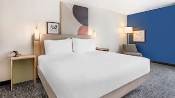 Desk, laptop workspace, blackout drapes, iron/ironing board