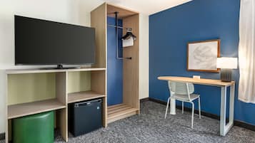 Desk, laptop workspace, blackout drapes, iron/ironing board