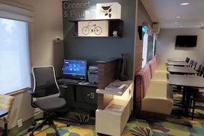 Relax in a well-appointed room with a desk, sofa, and TV.