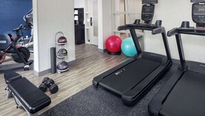 A gym with treadmills, dumbbells, exercise balls, and a bench. - Hampton Inn Atlanta-Northlake (Atlanta)