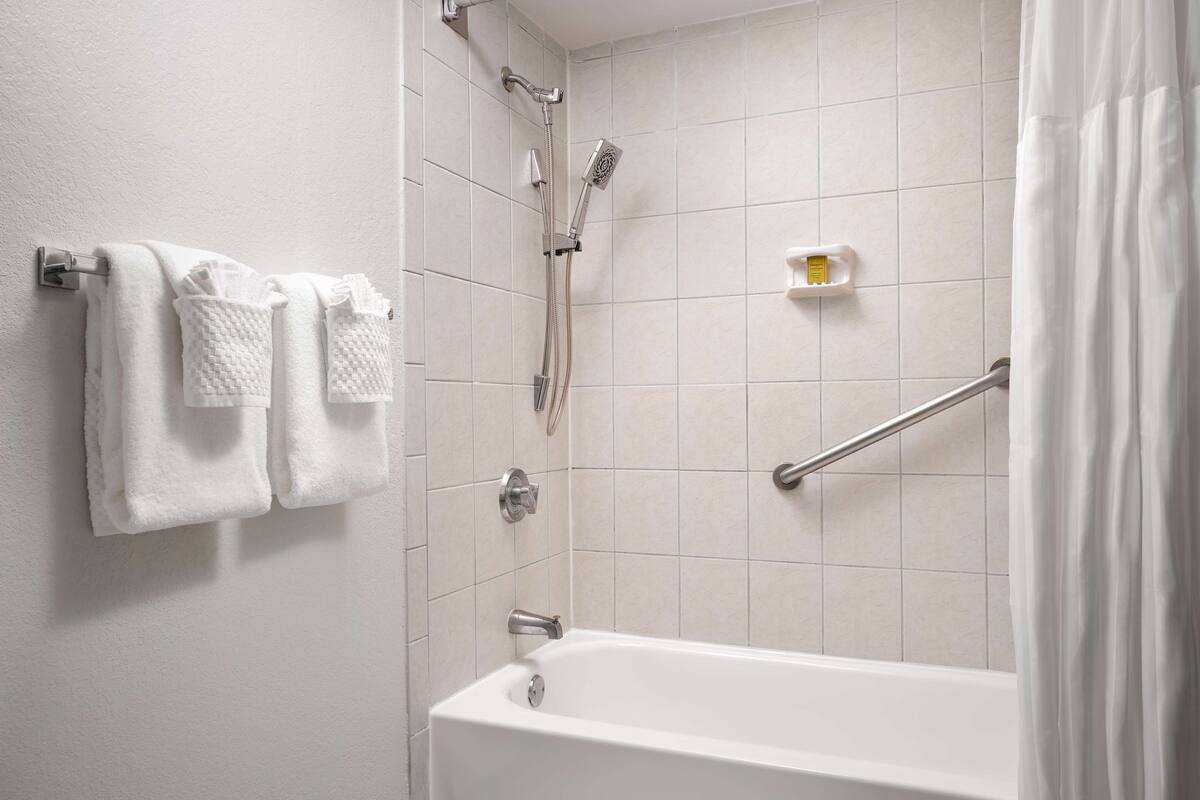 room, 1 queen bed, balcony (hearing) | bathroom | designer toiletries, hair dryer, towels, soap