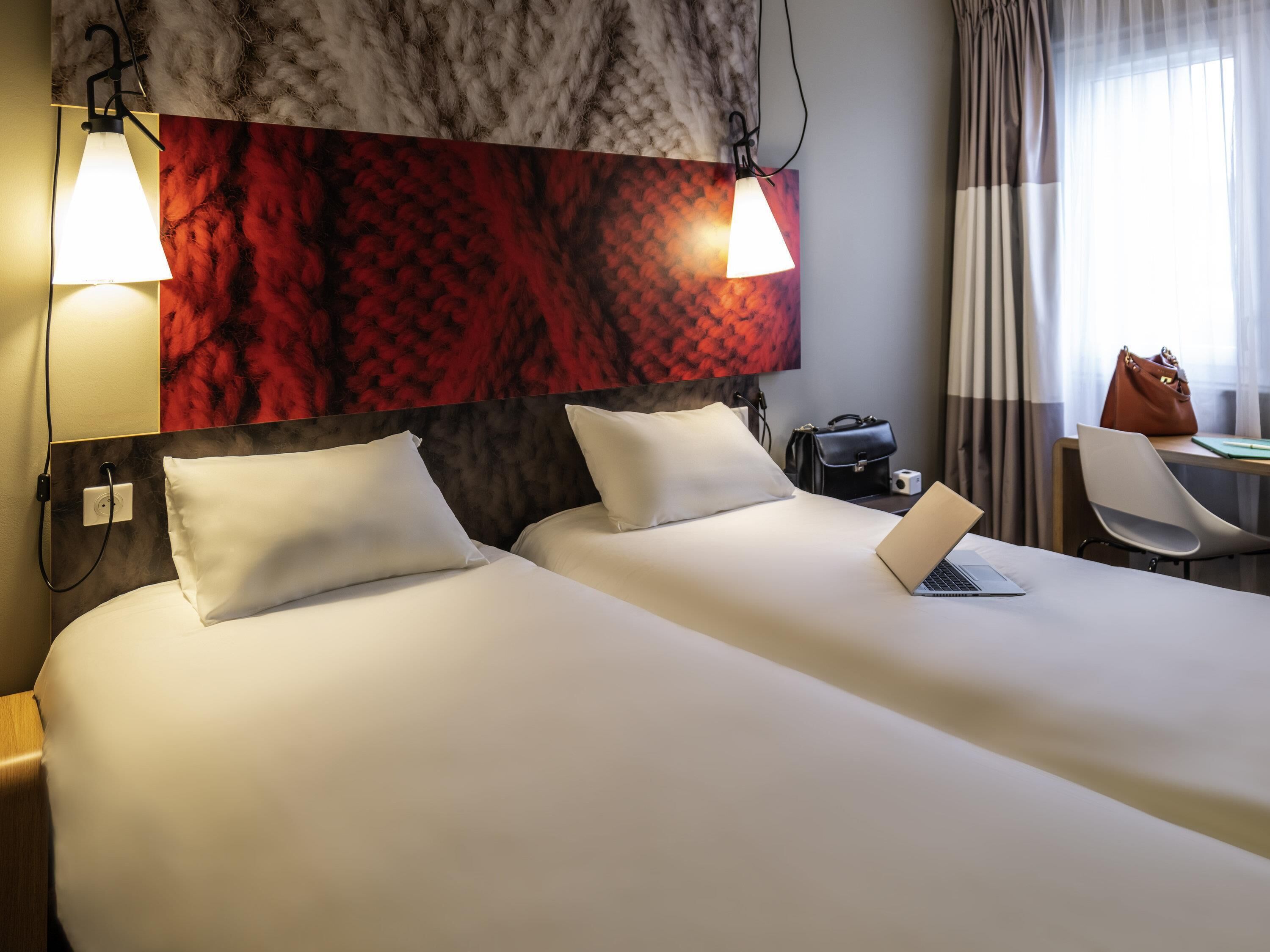 Premium bedding, desk, laptop workspace, blackout curtains