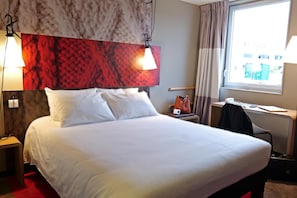 Premium bedding, desk, laptop workspace, blackout curtains