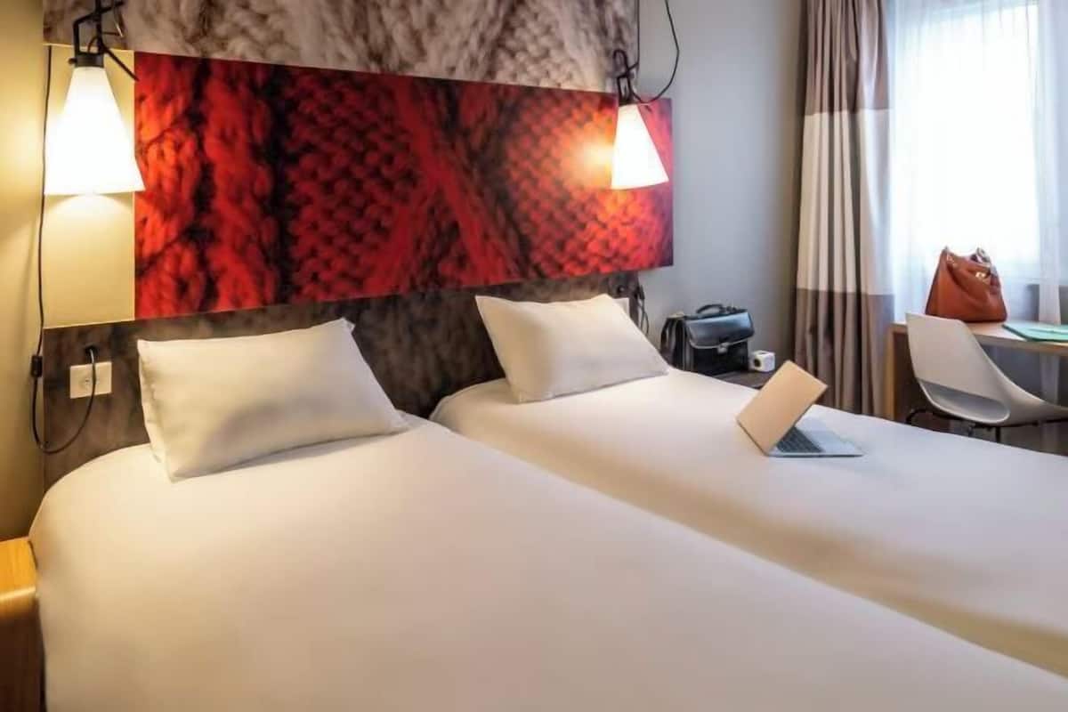 Premium bedding, desk, laptop workspace, blackout curtains