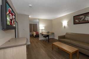 Suite, 1 Queen Bed, Non Smoking | Desk, laptop workspace, blackout drapes, iron/ironing board