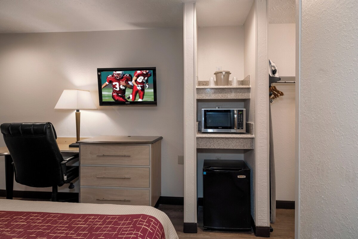 Desk, laptop workspace, blackout curtains, iron/ironing board