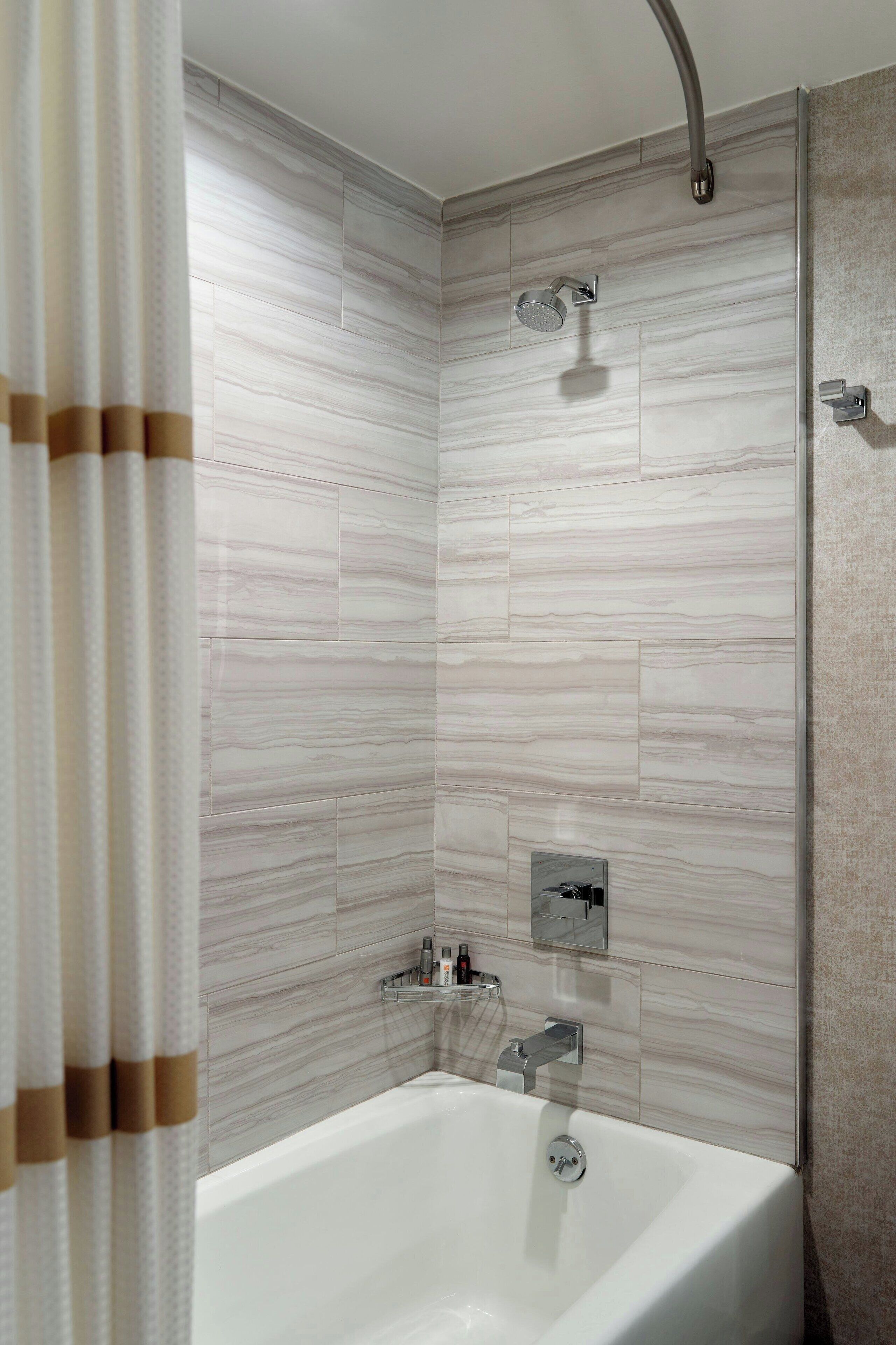 combined shower/bathtub, free toiletries, hair dryer, slippers