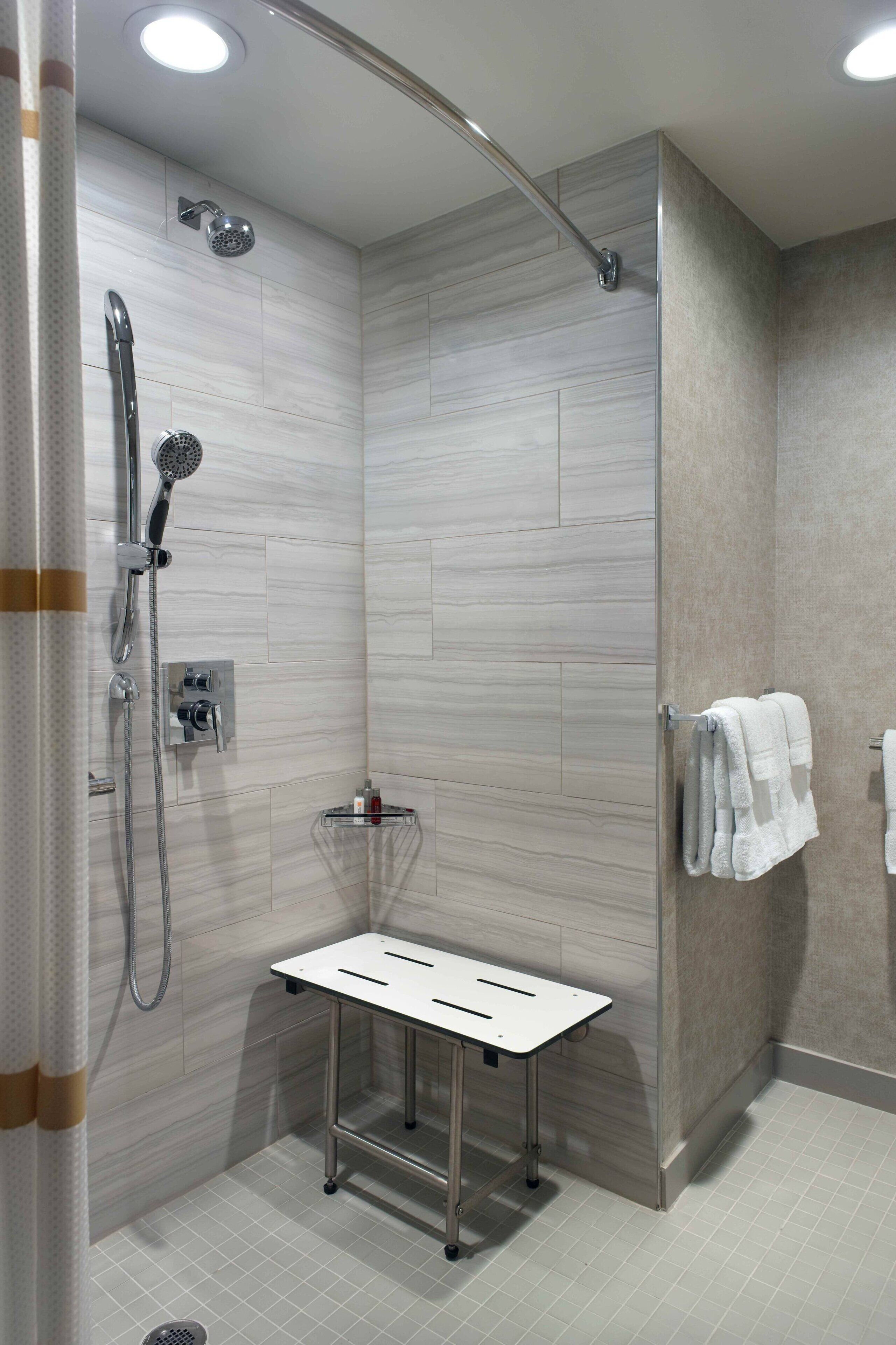 combined shower/bathtub, free toiletries, hair dryer, slippers