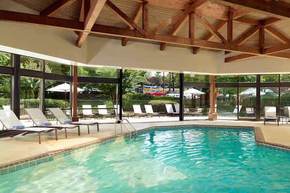 Indoor pool, pool umbrellas, pool loungers