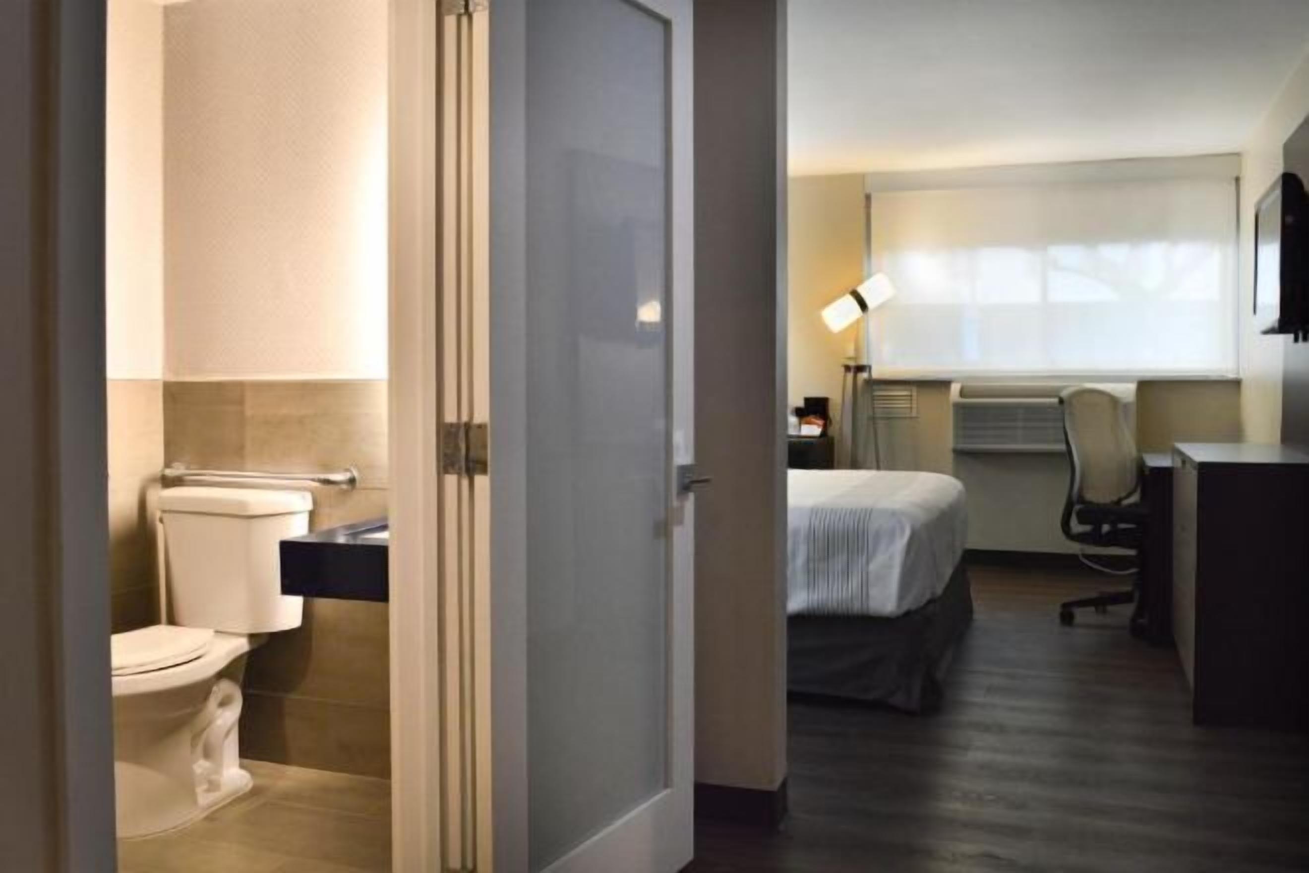 Desk, laptop workspace, blackout curtains, iron/ironing board