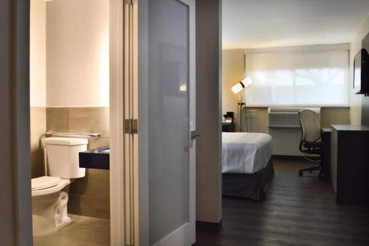 Desk, laptop workspace, blackout curtains, iron/ironing board