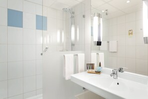 Separate tub and shower, rainfall showerhead, eco-friendly toiletries