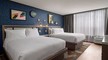 Premium bedding, desk, laptop workspace, blackout drapes