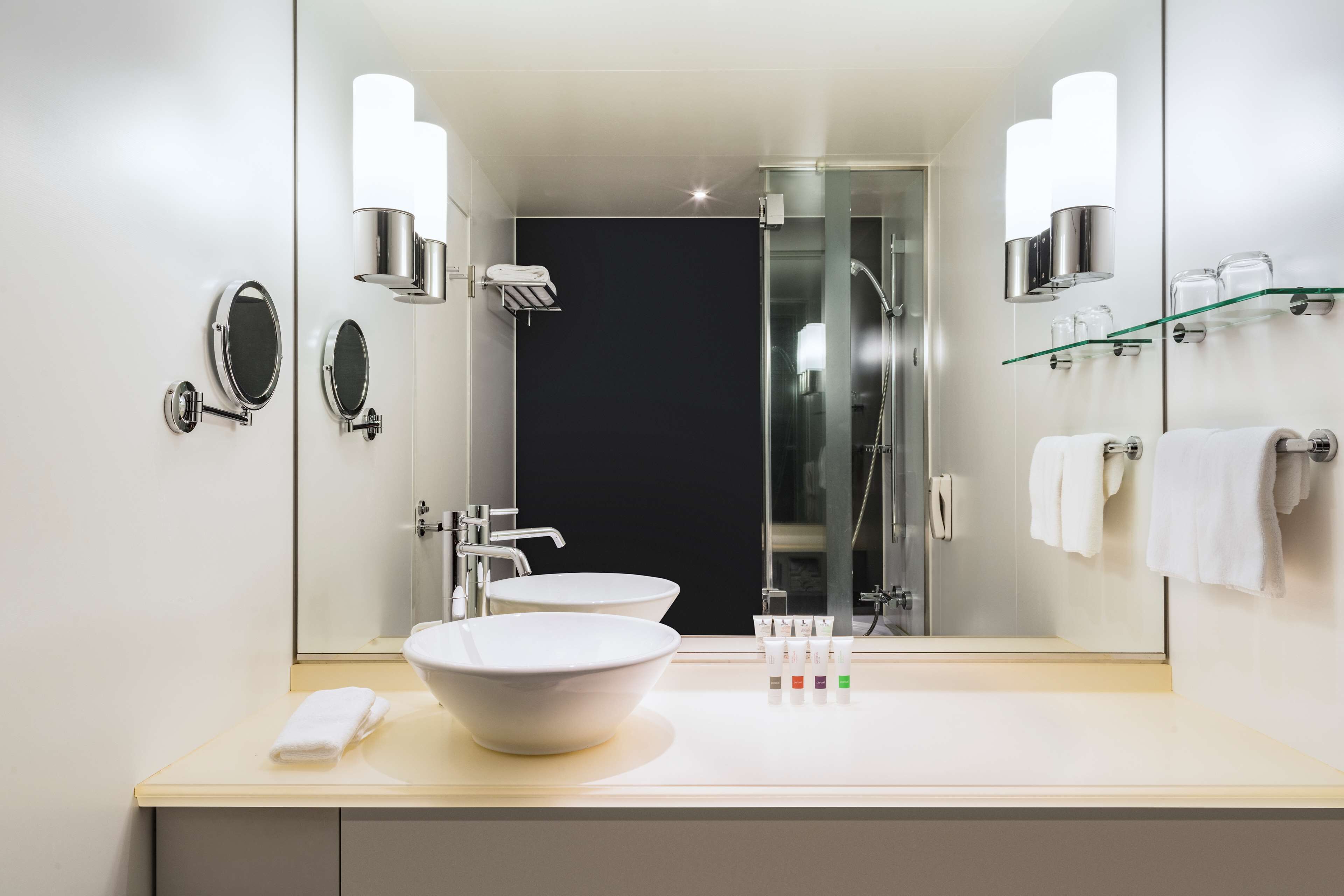 eco-friendly toiletries, hair dryer, slippers, towels