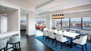 A modern dining area with a city view, white furniture, and a blue patterned rug. - The Westin Copley Place, Boston, a Marriott Hotel (Boston)