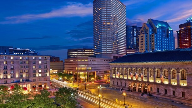 A cityscape with a prominent hotel featuring a classic facade, a modern high-rise, and a historic building with arched windows. - The Westin Copley Place, Boston, a Marriott Hotel (Boston)